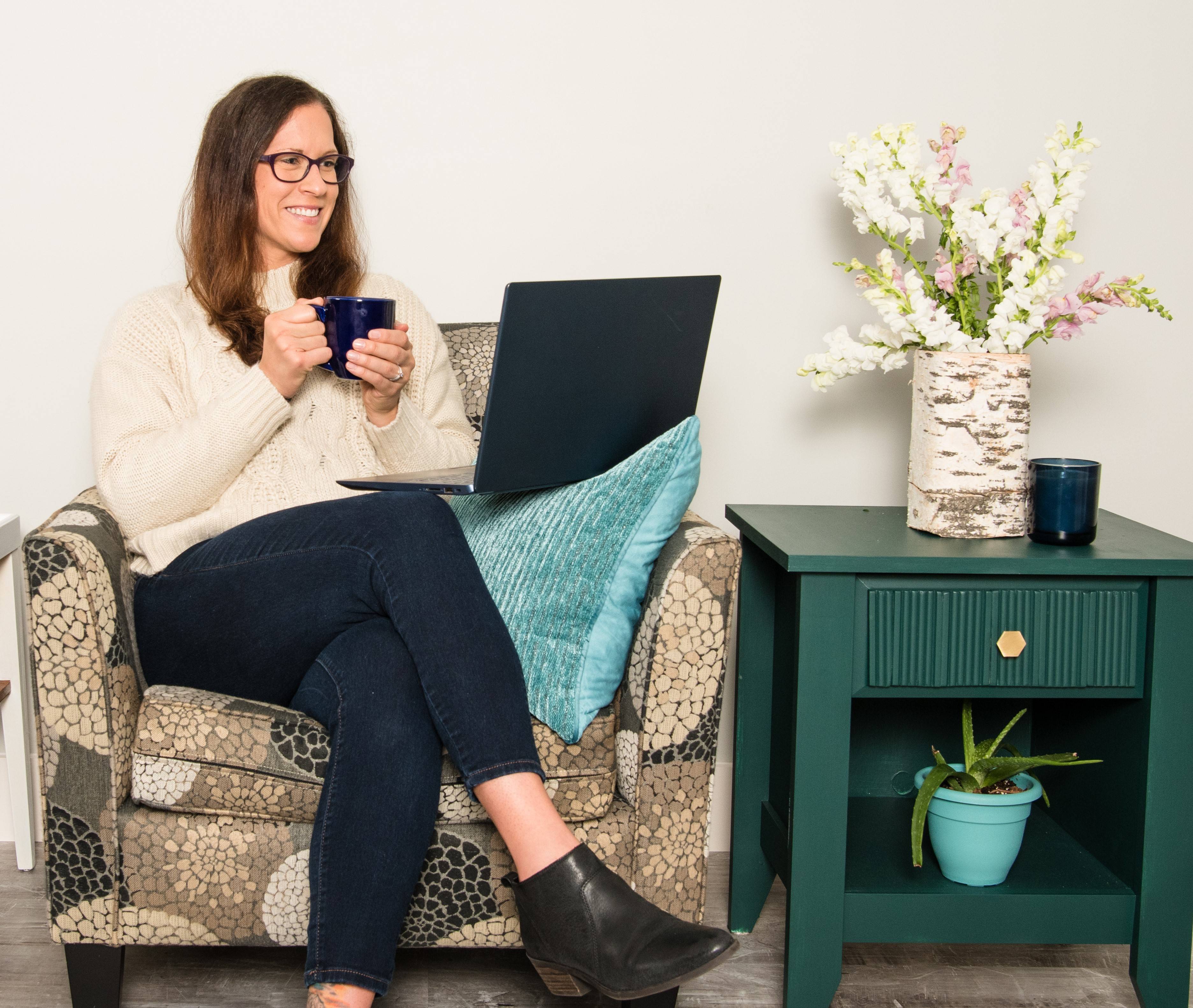 Becky sitting with coffee