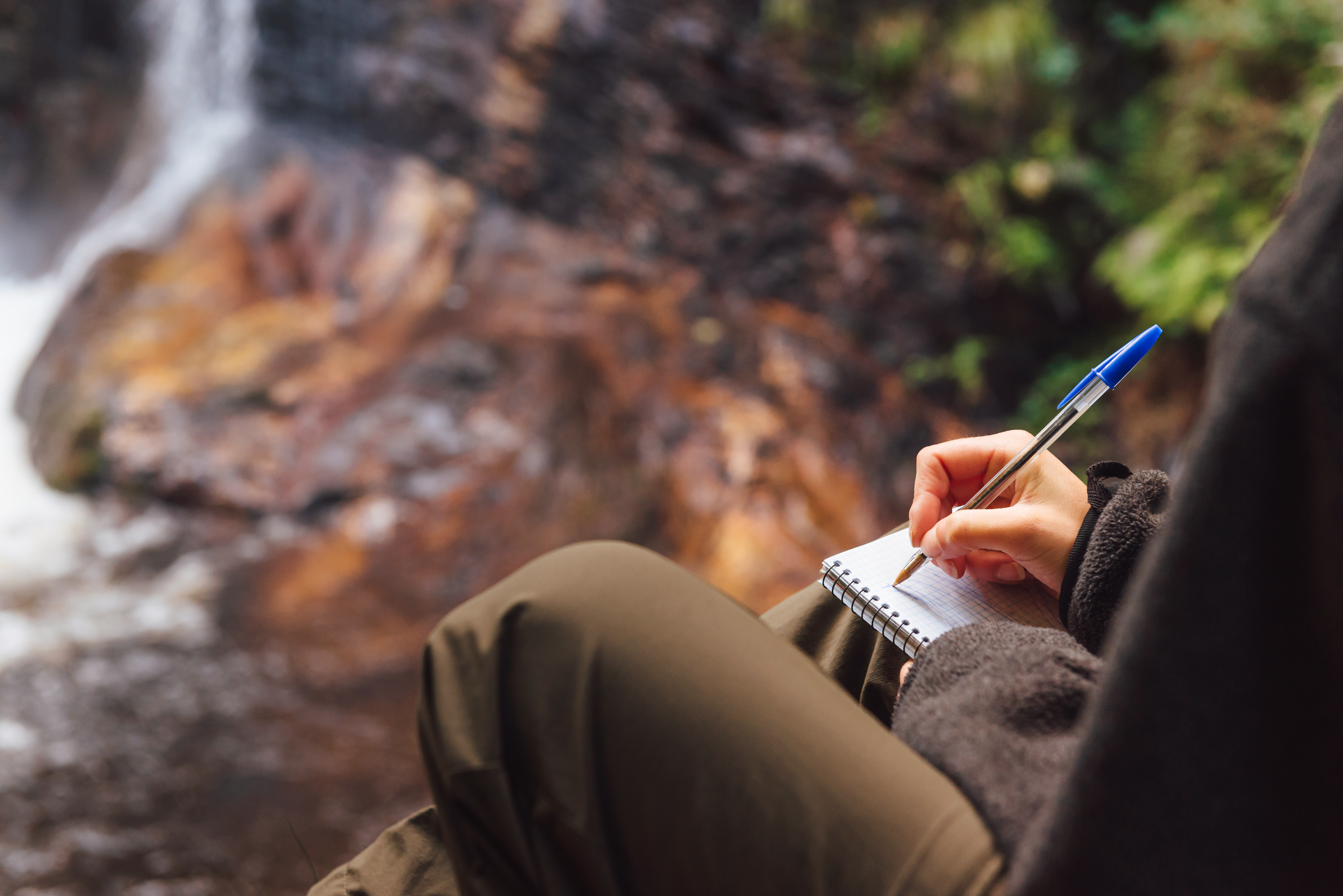person taking Notes in nature